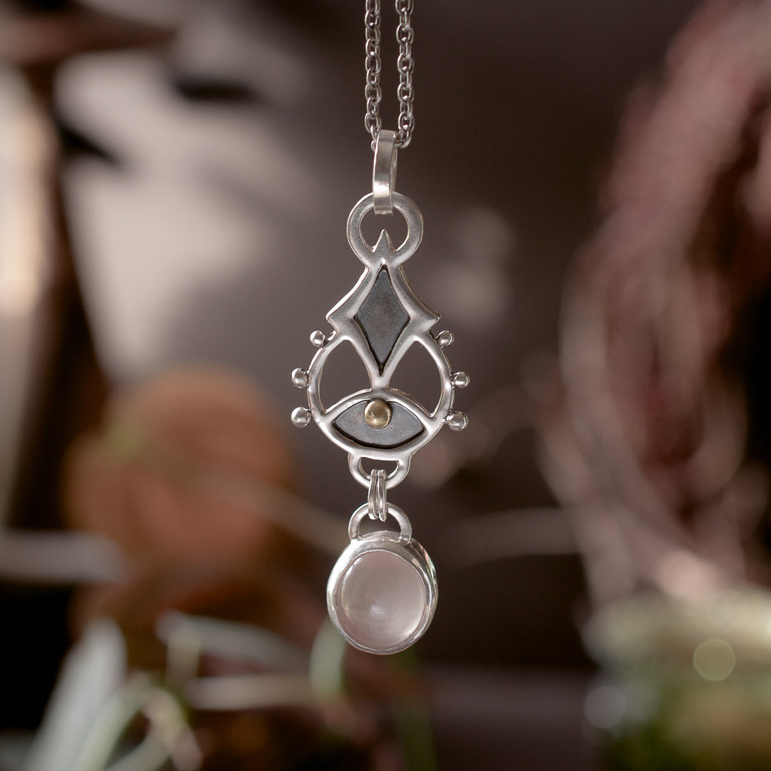 Hand crafted sterling silver sigil jewelry for awakening your intuition featuring a rose quartz.