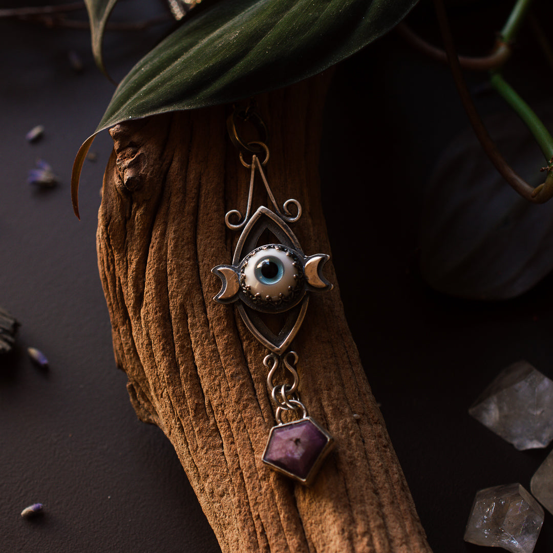 Mandorla pendant with a layered triple goddess symbol with a handmade glass eye.