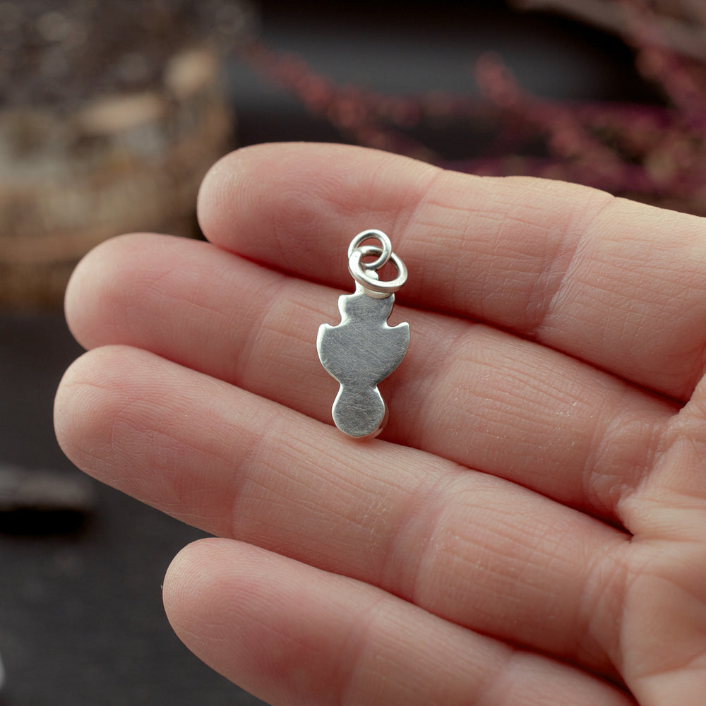 
                  
                    Nestled Knowing Charm
                  
                
