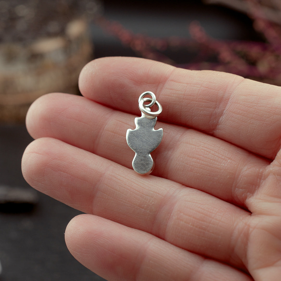 
                  
                    Nestled Knowing Charm
                  
                