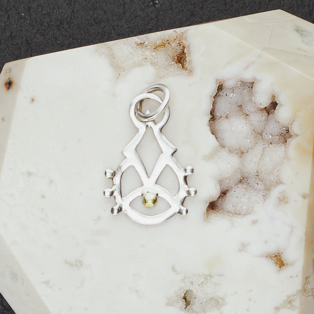 
                  
                    Rising Consciousness Charm
                  
                