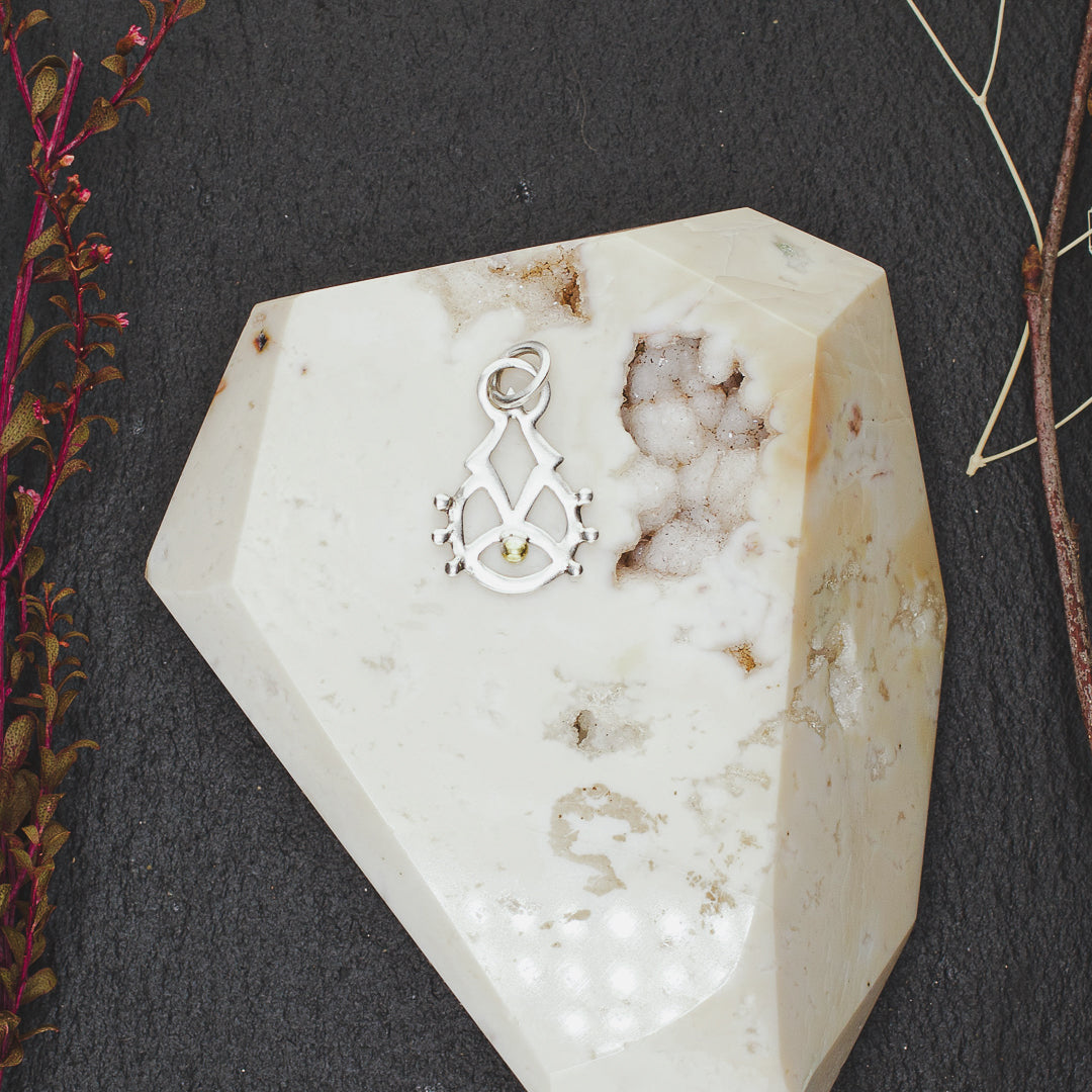 
                  
                    Rising Consciousness Charm
                  
                