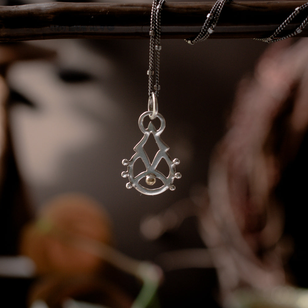
                  
                    Rising Consciousness Charm
                  
                