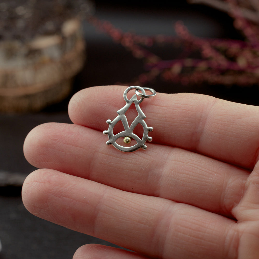 
                  
                    Rising Consciousness Charm
                  
                