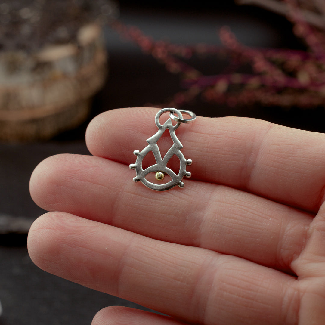 
                  
                    Rising Consciousness Charm
                  
                