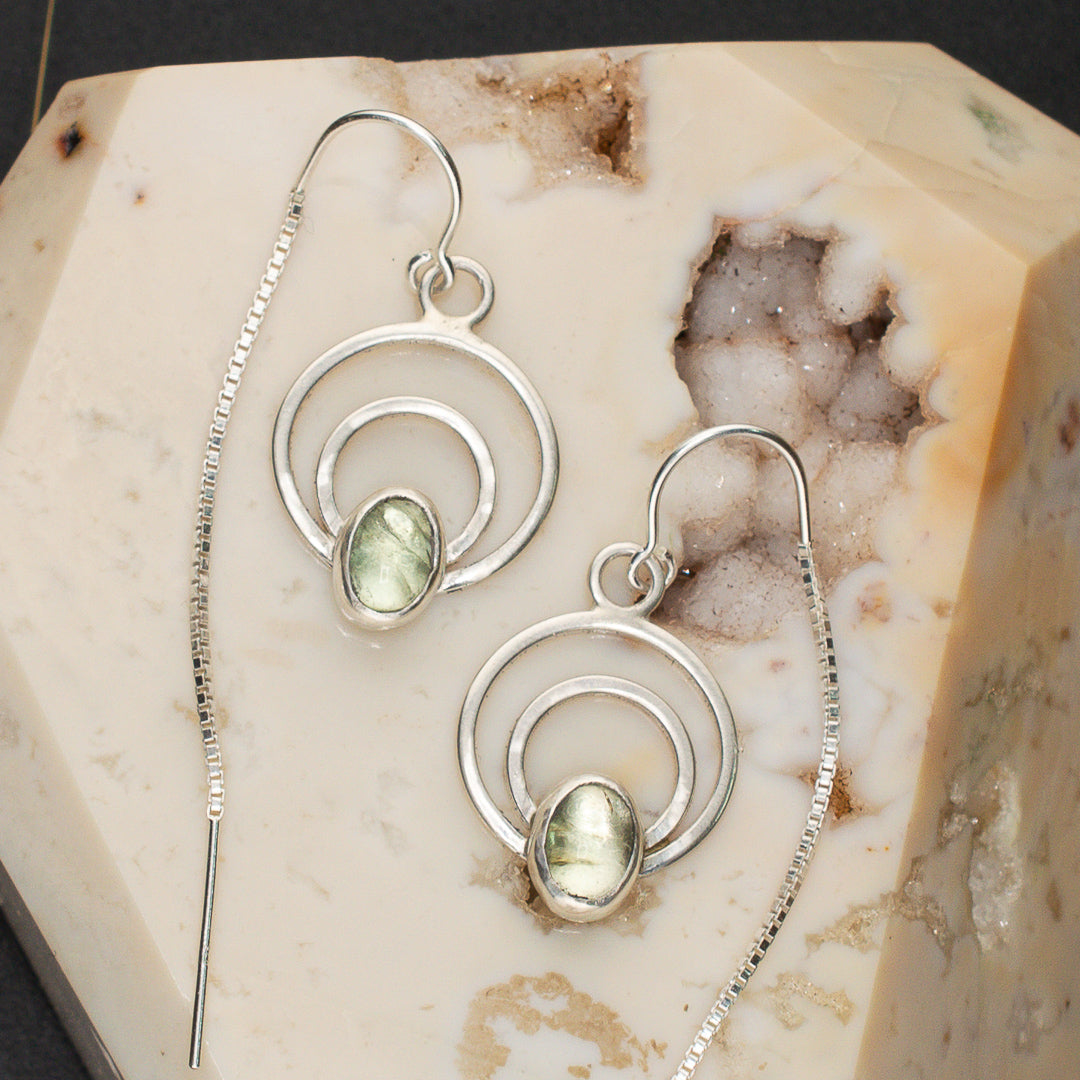 Close up of mint tourmaline sterling silver ear threader earrings.